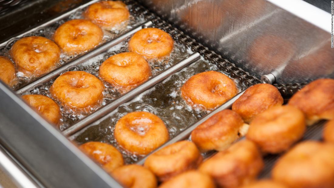 Deep frying doughnut machine close up Fit Kab Dao
